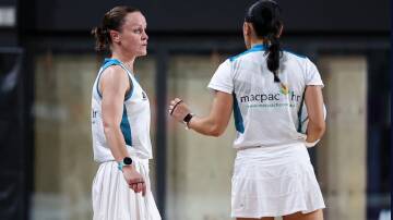Amanda McLachlan confers with fellow umpire Betty Zhang at the Australian Men's & Mixed Netball Association national championships last month. Picture supplied