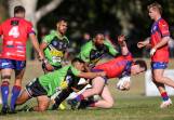 Albury's Frederick Wells and Jackins Olam tackle Kangaroos' Ned Cooper. Picture by James Wiltshire. 