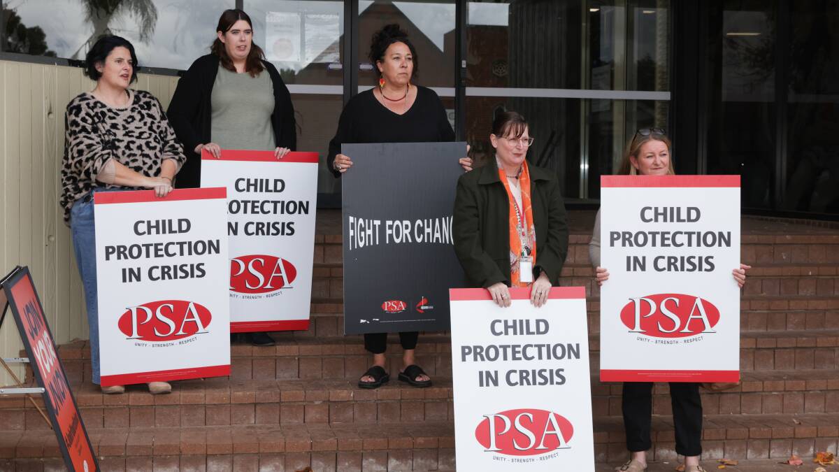 Child protection case workers rallied outside the DCJ Community Services Centre on Tompson Street in Wagga on May 8. Picture by Tom Dennis