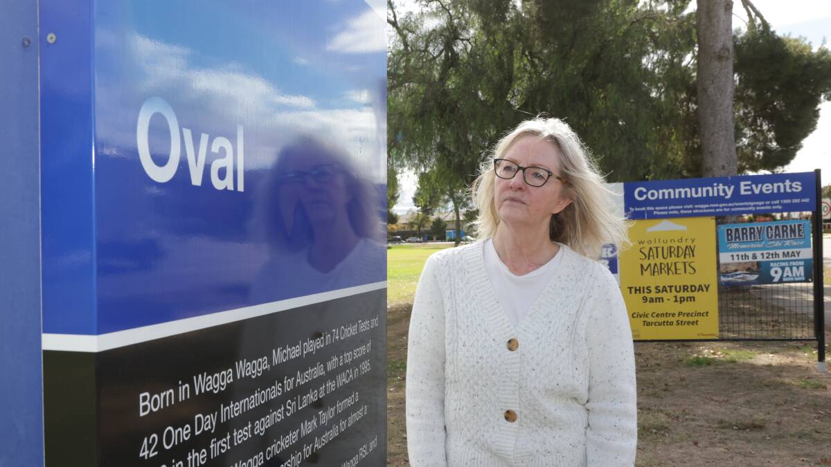 Wagga City Councillor Jenny McKinnon with the painted over sign at Wagga's Michael Slater Oval on Wednesday. Picture by Tom Dennis