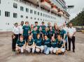 Hello sailors: The Rotary delegation from the Border with cruise ship crew members in front of the Pacific Adventure in Port Vila, before their voyage home. Picture supplied