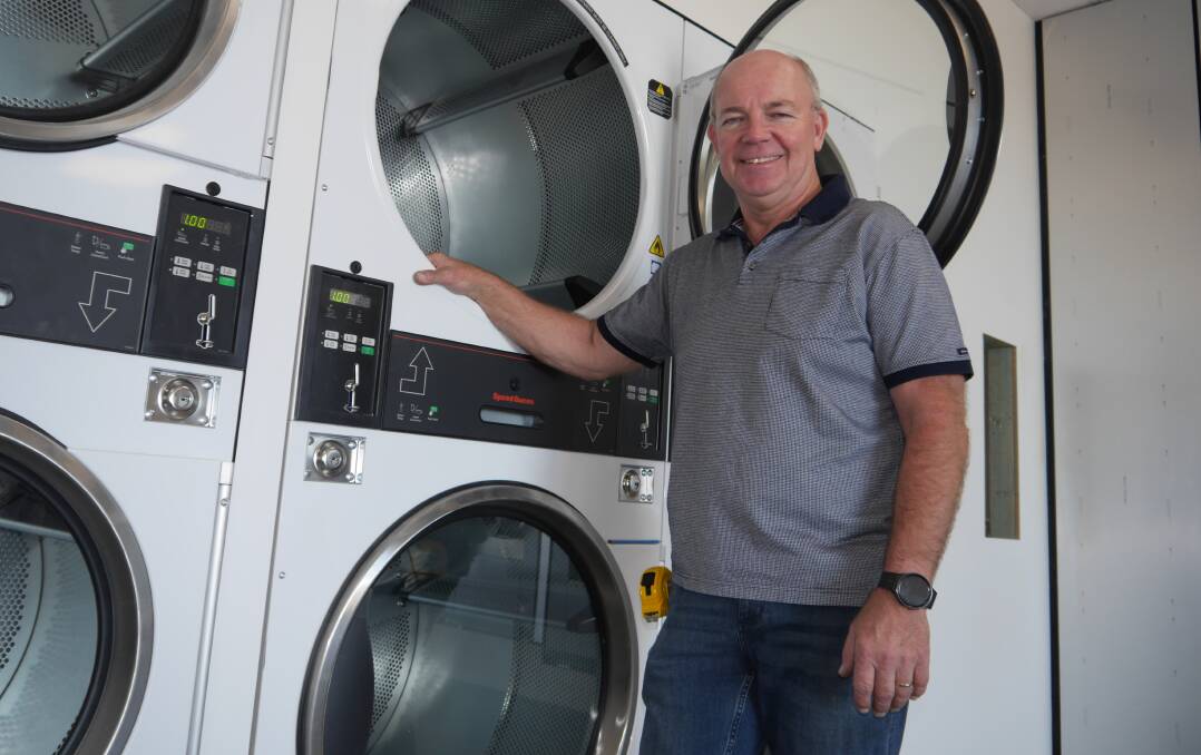 Rod Krause shows off some of the brand new industrial dryers fitted out to the first shop of his Splash Laundrette to be located in the northern suburbs. Picture by Andrew Mangelsdorf