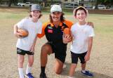GWS Giants ruckman Nick Madden with Wagga brothers Lachlan Glazier, 9 and Patrick Glazier, 8 at the footy clinic run by AFL Riverina on Thursday. Picture by Les Smith