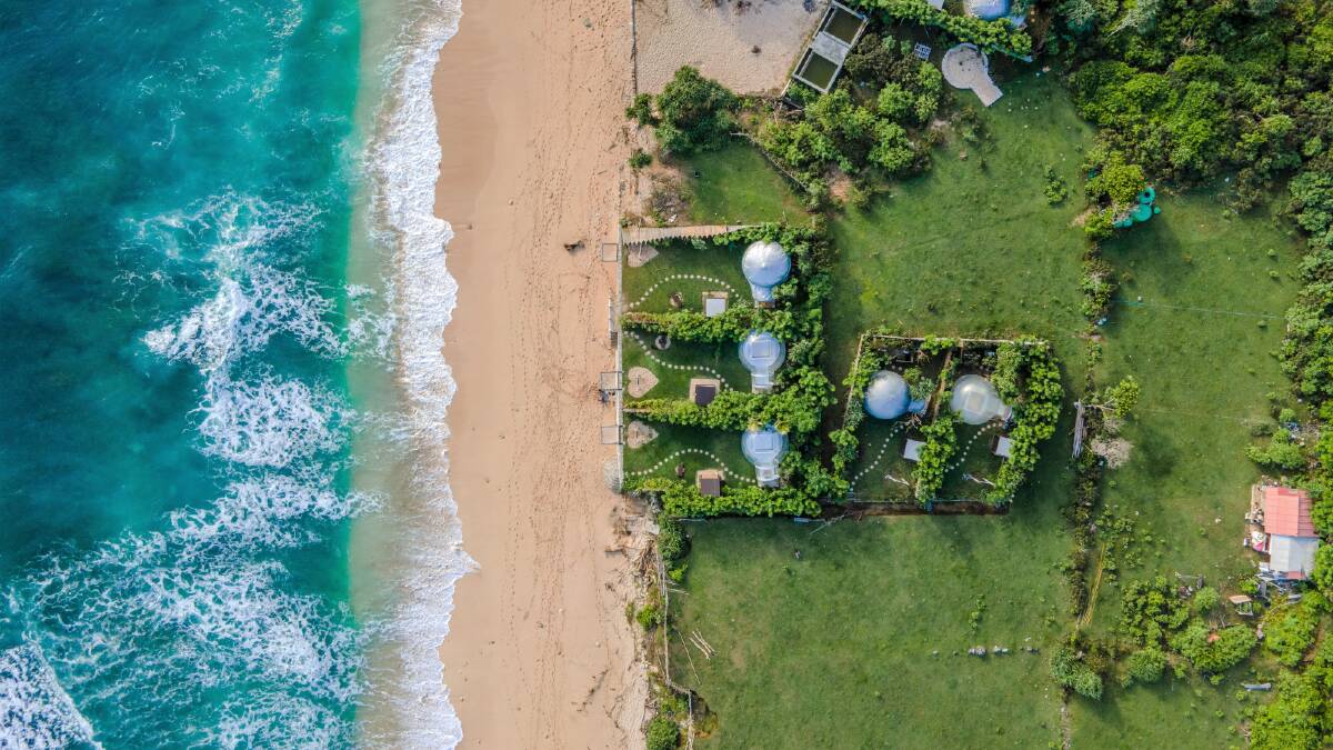 A Bali beach from above. Picture via Canva