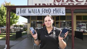 The staff at The Walla Food Mill, including co-manager Josie Atkins, have had to make the temporary switch to Optus to operate their EFTPOS terminals. Picture by Mark Jesser