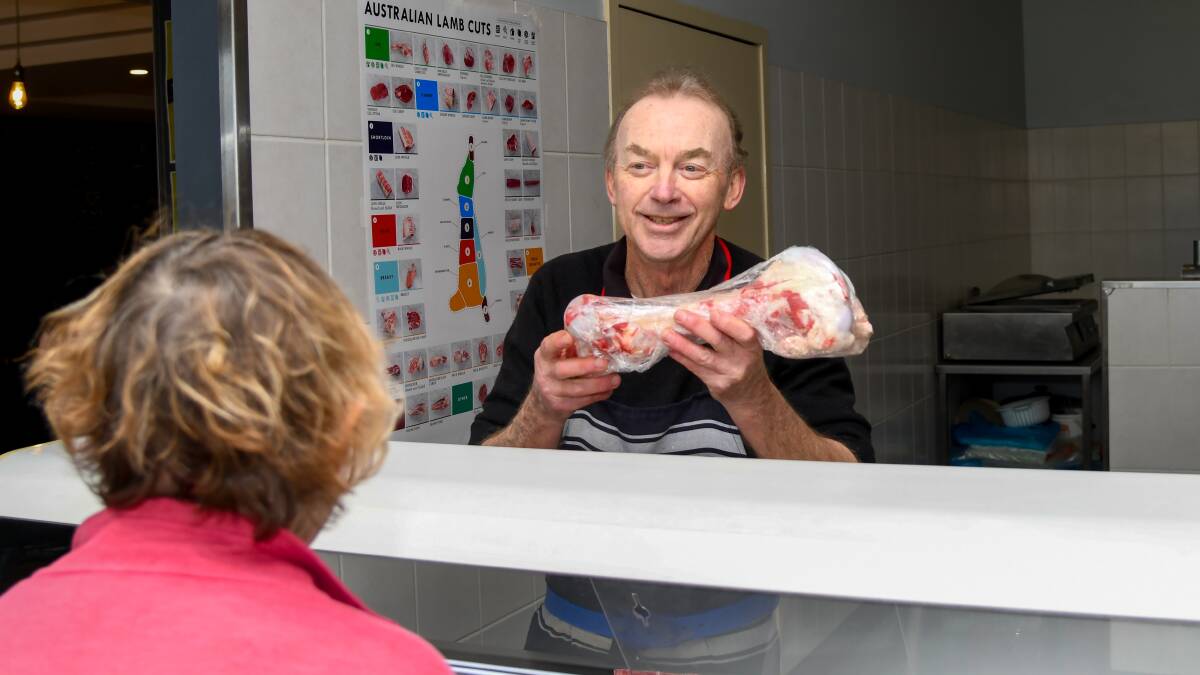 Turvey Park butcher Greg Tooze serves customers who are buying their meat day to day instead of in bulk. Picture by Bernard Humphreys