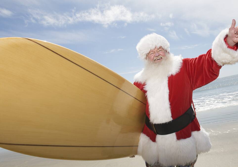 Getting ready: When not working, Santa enjoys taking to the waves. Every Christmas Eve, Santa along with all his helpers enjoy one last surf before starting on their biggest night of the year. 