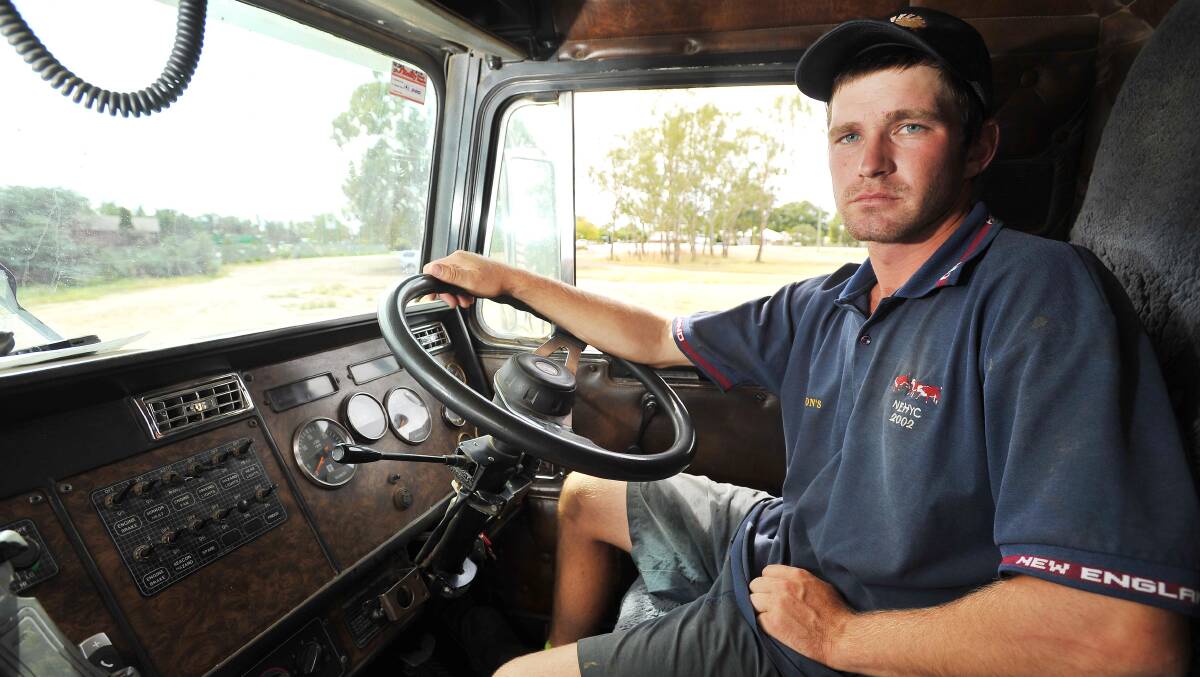 IN THE DRIVER'S SEAT: Livestock carrier Adam Manwaring of Uranquinty delivers hay to producers affected by fire. 
