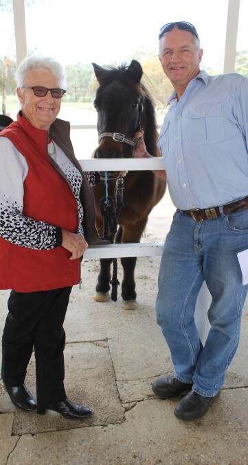 TAKE THE LEAD: Wagga Riding For The Disabled president Bev Amery is pictured with livestock agent Scot Mehegan and pony Nugget. Picture: Nikki Reynolds