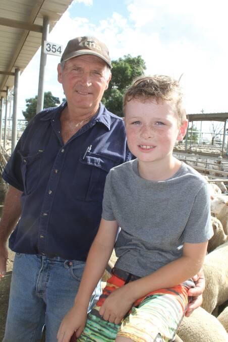 Vendor Mick Heinjus of "Spring Hill", Junee pictured with grandson Riley Dobson, 7. Mr Heinjus sold 143 lambs for $170 at the Wagga sheep sale. Picture: Nikki Reynolds