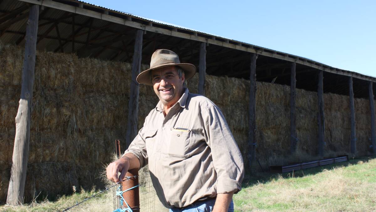 TAKING STOCK: Bill Muller of "Nunlong", Bethungra is pictured near the hay shed on his southern NSW property. 