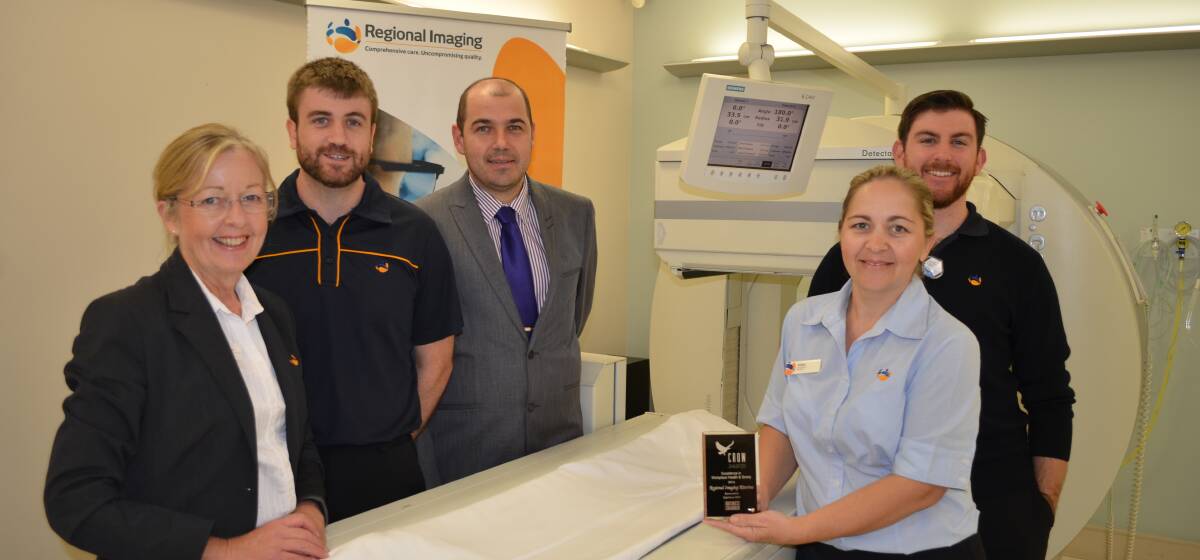 Regional Imaging staff (from left) Jayne Lewis, Campbell Finlay, Nic Carusella, Vickie Kendall and George Roy with the Crow Award for Workplace Health and Safety. 