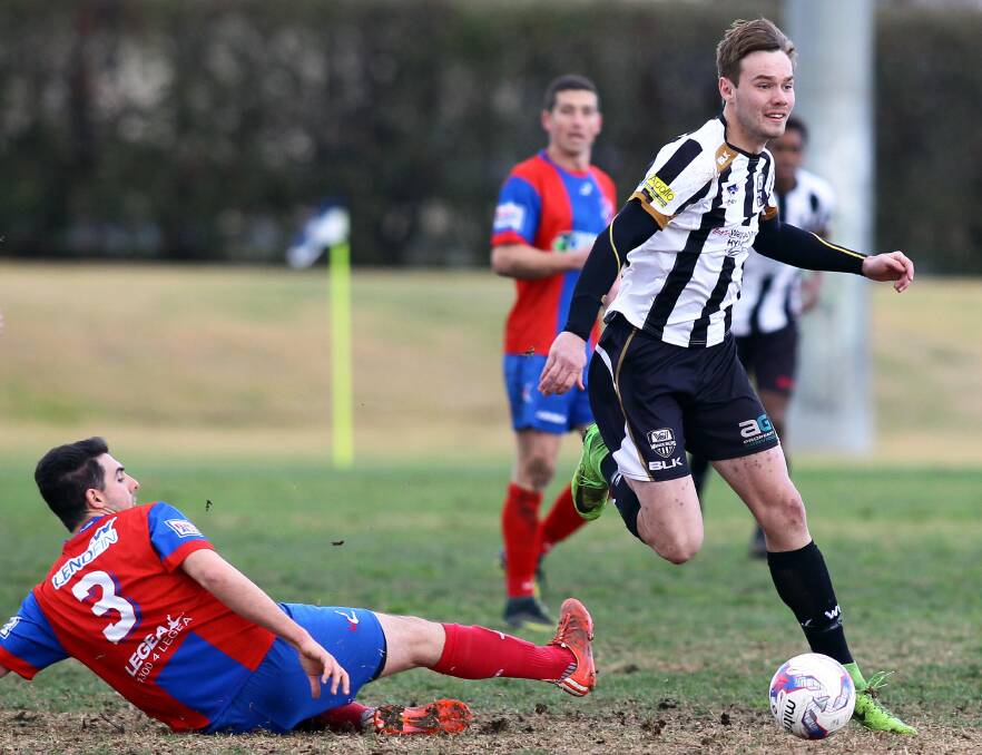 BACK IN BLACK (AND WHITE): Premiership winning Henwood Park striker Jake Ploenges is one of many big names to commit to the Wagga City Wanderers for next season. Picture: Les Smith