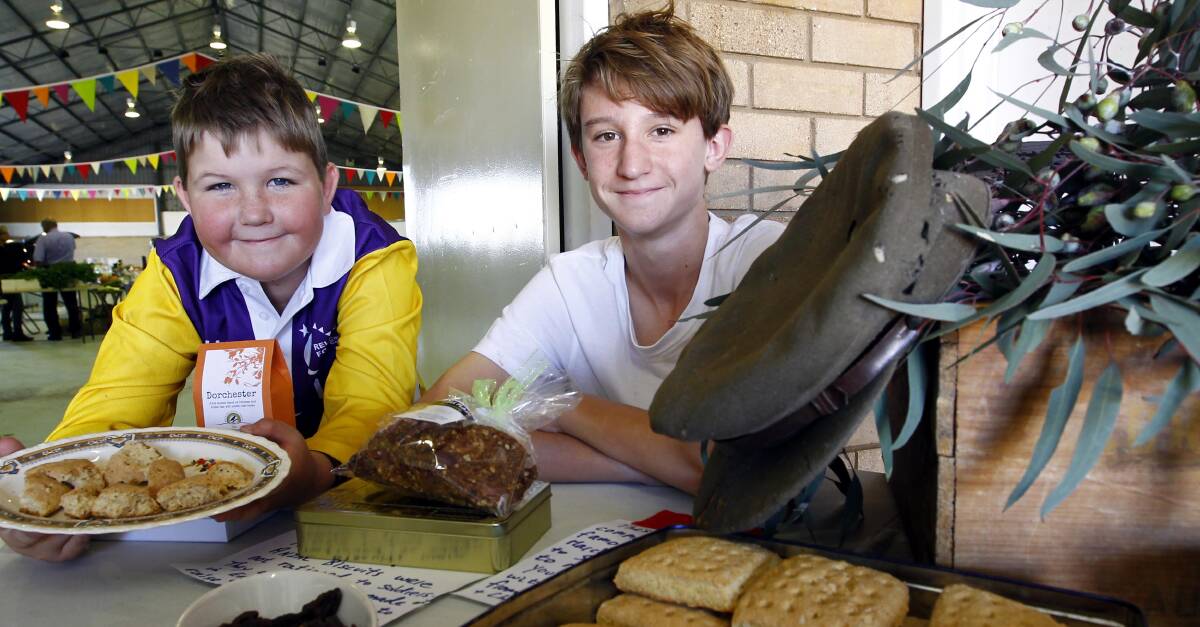 ANZAC SPIRIT: Nicholas Anderson, 11, and Matt Anderson, 13, check out the Anzac food on offer at the Riverina Producers Market on Thursday. Picture: Les Smith 