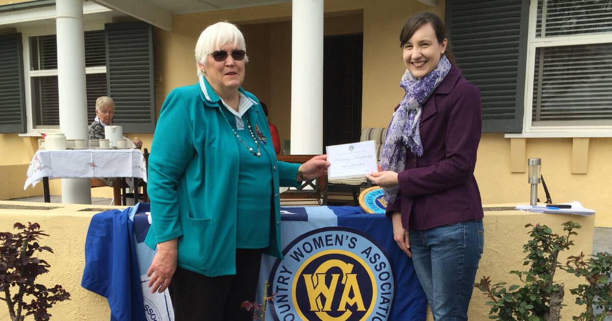 BIG DAY: CWA Riverina president Anne Adams presents agriculture business student Aimee Snowden with an honourary membership during CWA's awareness week. 