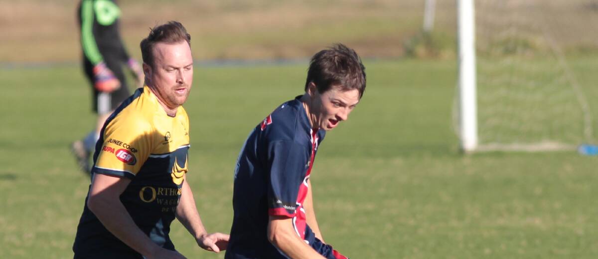 STEPPING UP: Junee Jaguars coach Lincoln Weir, pictured chasing Henwood Park's Sam Thompson, will likely share goalkeeping duties with his brother, Adrian Weir. 