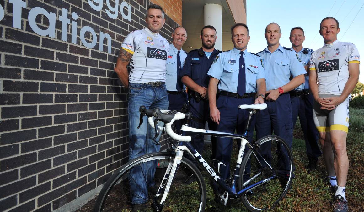 WILD RIDE: Marc Lawrence (third from the left), before the 2014 NSW Police Legacy Ride with Tony Aichinger, Inspector Peter McLay, Sergeant Phil Malligan, Constable Richard Moffatt, Senior Constable Cameron Mitter and Simon Haworth. 