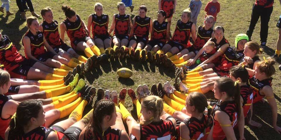 UNITED: The Riverina Lions showing their support for much-loved murdered teammate Stephanie Scott by displaying her favourite colour at McPherson Oval on Saturday. Picture: Supplied 