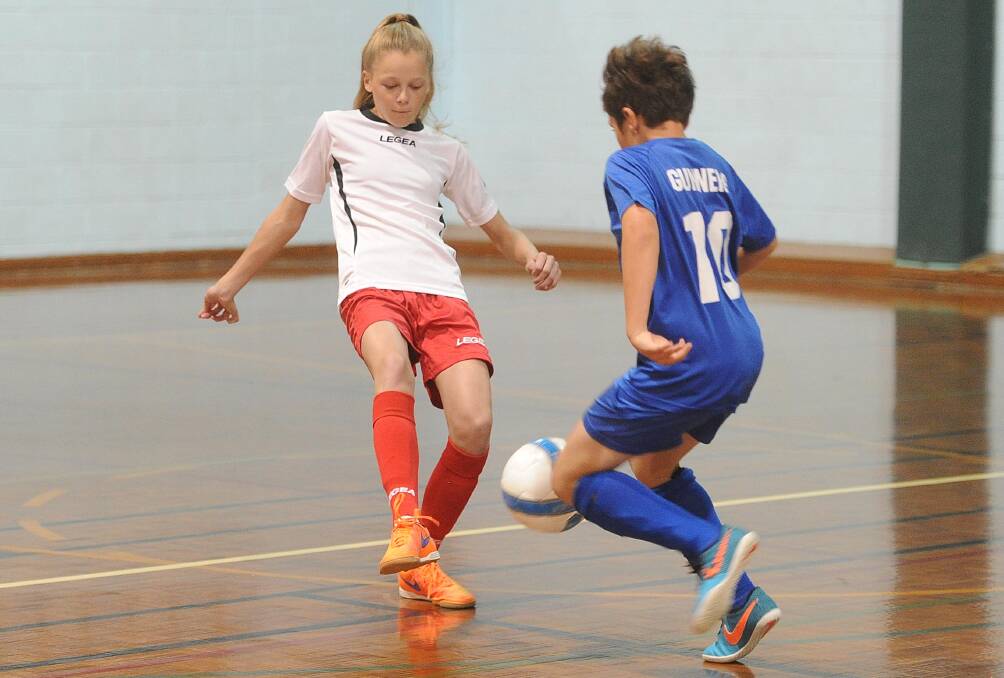 Gracie Doodyer and Clayton Gunning in action during the 2016/17 Wagga Futsal season. 