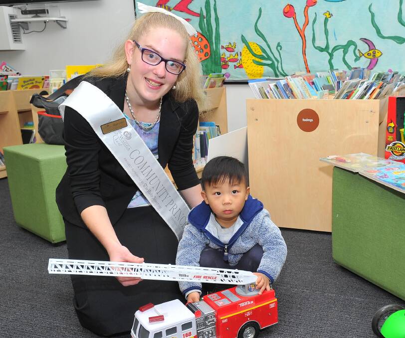 LENDING A HAND: Community Princess Megan Short stopped by the Wagga Toy Library to donate a host of toys for young children like Anthony Wang, 2.