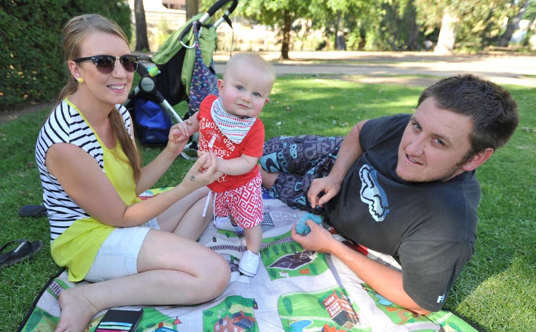 HAPPY NEW YEAR: Kirsty Taylor, Ace Girling and Ryan Girling, all of Wagga, rang in 2015 at last year's New Year's Eve event at the Victory Memorial Gardens. Picture: Kieren L Tilly