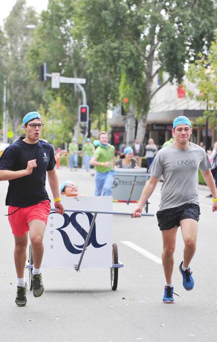 HOME STRETCH: Jamie Cham, Wui-Kwan Wong and Patricka Markey won Chariots for Charity as part of the UNSW Rural Clinical School team. Picture: Kieren L Tilly