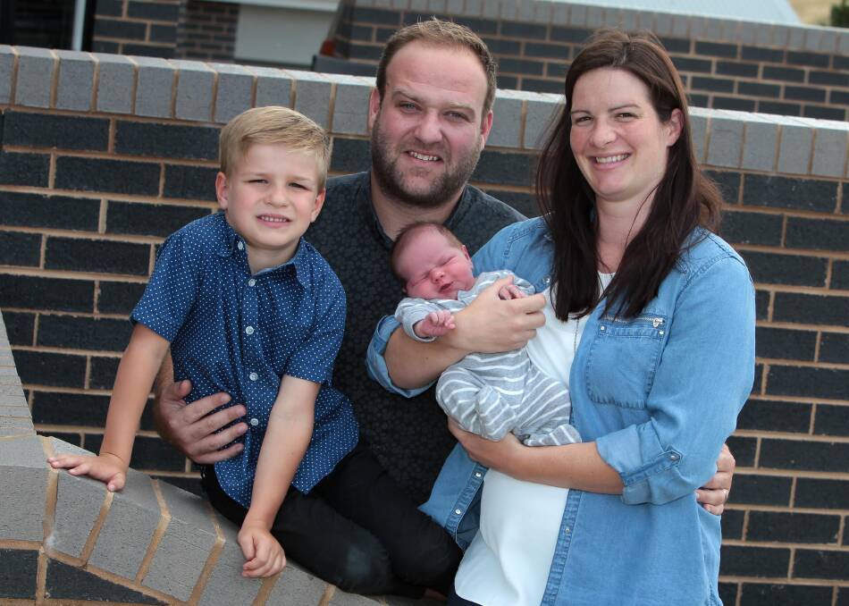NEW BEGINNINGS: Pastor Brendan McMartin with wife Melissa and their two children, Toby, 5, and Oliver, almost one week, at their new home in Wagga. Picture: Les Smith 