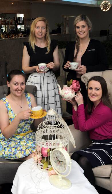TEA TIME: Miss Wagga Quest entrants Katharine Graham, Liz Coolee, Jes Smith and Sarah Navin prepare for the final fundraiser. Picture: Les Smith
