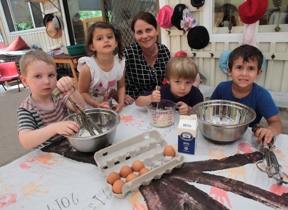 PANCAKE DAY: St Luke's Preschool educator Kath Rodham with Max Russell, Monica Stephen, Hamish Brown and Jed Rose prepare for Shrove Tuesday. Picture: Les Smith