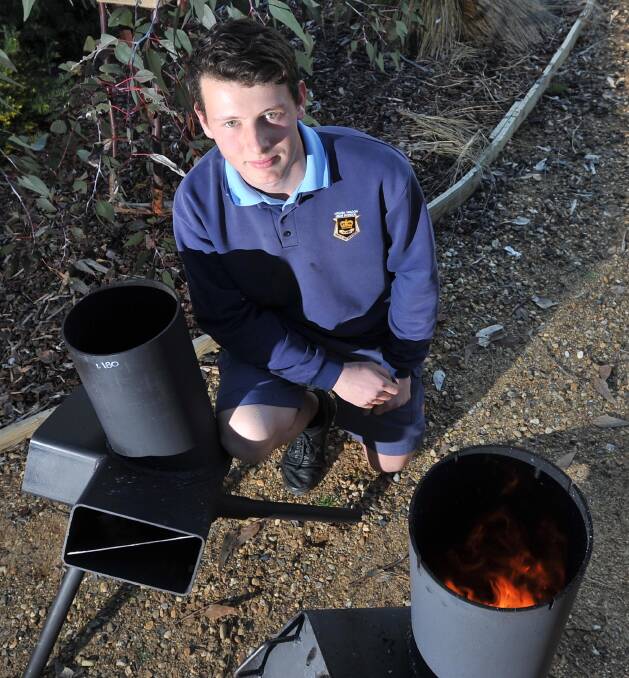 ENTREPRENEUR: Henry Standley, 15, made a fire bucket as a school project and is using his new skills to start a business called Henry's Heaters. He sold his creations at the Wagga Swap Meet. Picture: Laura Hardwick