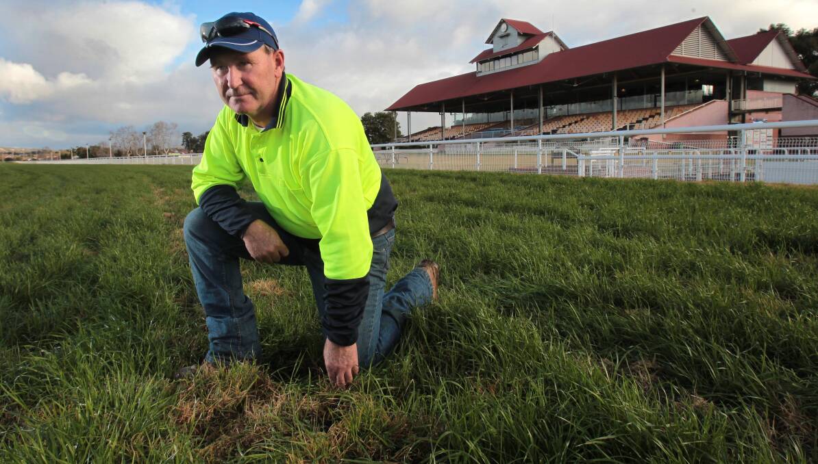 WET WINTER: Murrumbidgee Turf Club track manager Mark Hart looks over a rain-soaked Wagga racecourse on Wednesday. Picture: Les Smith