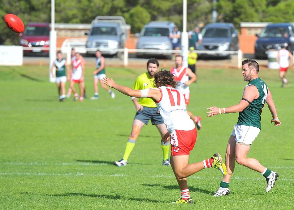 CLASS: Adam Schneider gets a kick away for Coolamon in the Riverina League clash against Griffith at Kindra Park on Sunday. Picture: Kieren L Tilly