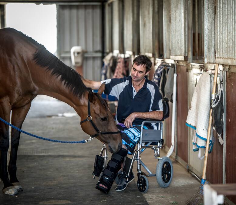STARTING OVER: Former Wagga trainer Garry Kirkup with Highly Geared at his Canberra stables. He is recovering from a car accident that claimed the life of his partner, Samara Johnson. Picture: Karleen Minney