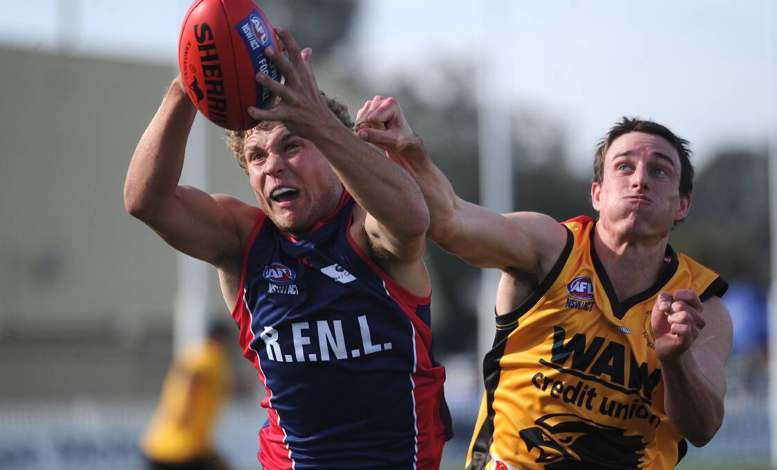 IN FRONT:: Riverina League's Jayden Klemke and Hume League's Duncan McMaster at Robertson Oval on Saturday. Picture: Laura Hardwick