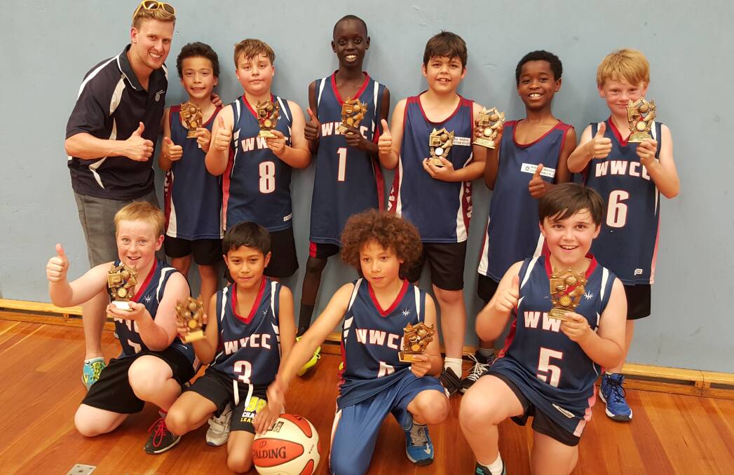 CHAMPIONS: Wagga Christian College's year three and four basketball team show off their spoils after winning a state carnival on Monday.