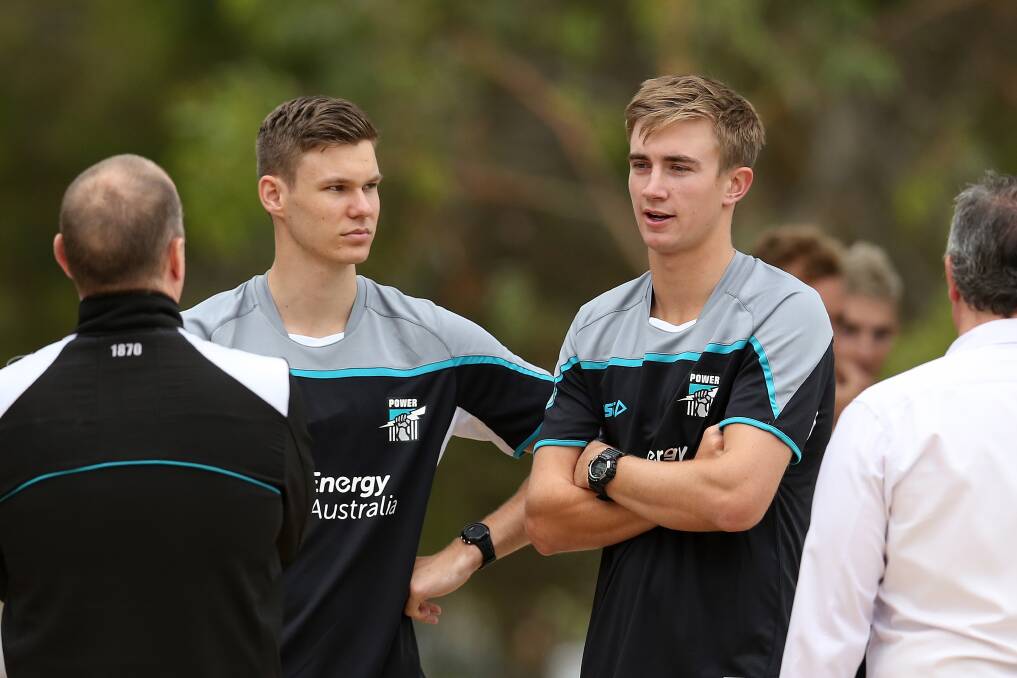 DONE WELL: Wagga teenager Dougal Howard (right) has been given a contract extension by Port Adelaide.