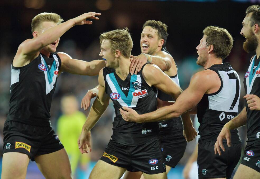 TOP COMEBACK: Dougal Howard celebrates the final goal of the game for Port Adelaide against Collingwood at Adelaide Oval on Sunday. Picture: AAP