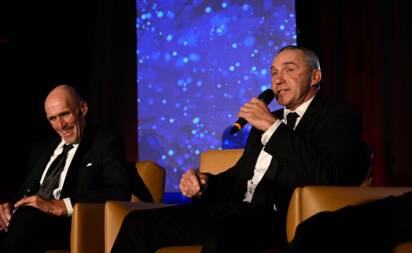 Wagga's Paul Kelly speaks on stage alongside good mate and former Sydney Swans teammate Tony 'Plugger' Lockett at the NSW Australian Football Hall of Fame gala dinner at the SCG on Friday night. Picture by Nigel Owen