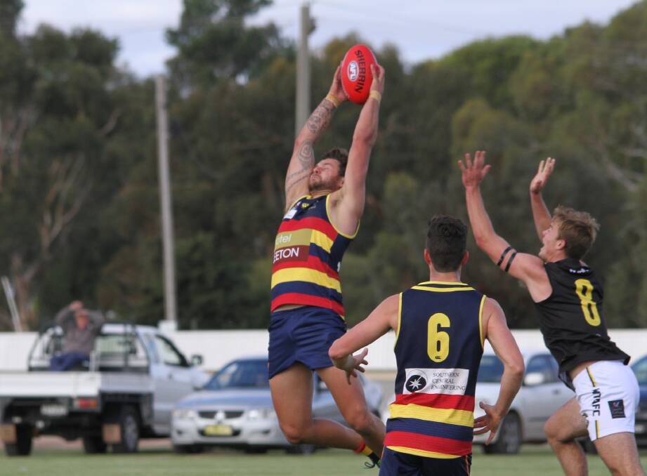 HIGH FLYER: Leeton-Whitton assistant coach Daniel Muir in action for the Crows this season. Muir is enjoying his first season at the Crows. Picture: Ron Arel