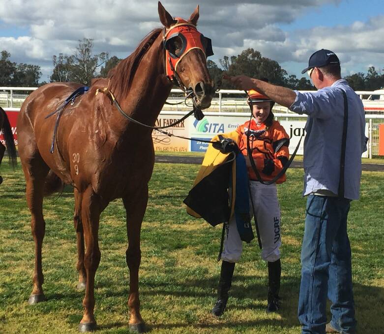 WINNING COMBINATION: Golan Power cools off as Gundagai trainer Andrew Sheahan talks with jockey Nyssa Burrells after a win in August. Picture: Gemma Cummins