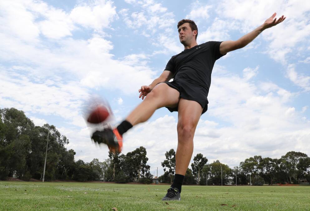 NEW CAREER: Wagga footballer Jack Brooks gets some practice punting at Anderson Oval in Wagga on Tuesday. Picture: Les Smith