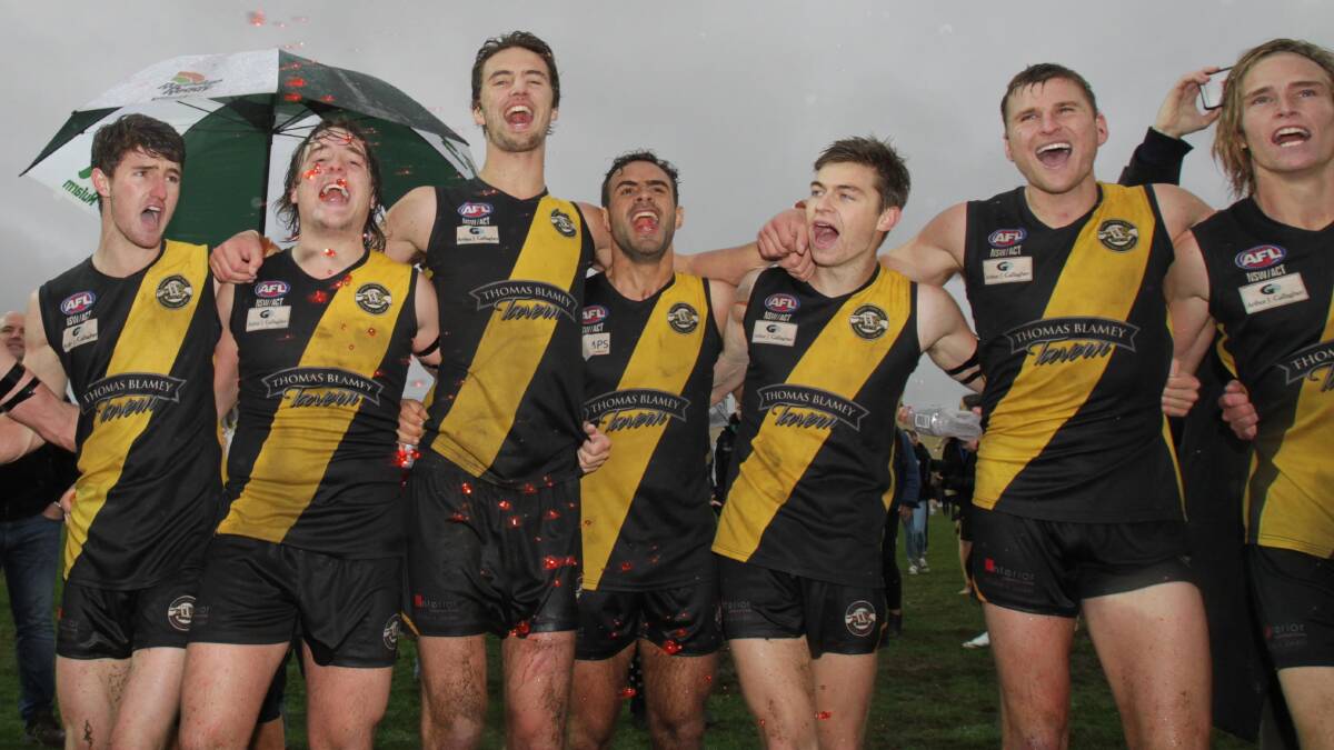 HAPPY DAYS: Jesse Manton (middle) celebrates Wagga Tigers' premiership alongside his teammates at Robertson Oval on Sunday. Picture: Les Smith