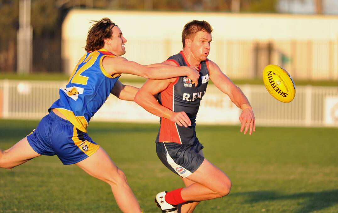 DOMINANT: Riverina League's Stace Creasy beats Tallangatta's Dylan Pritchard to the ball in Saturday's representative fixture at Robertson Oval. Picture: Laura Hardwick
