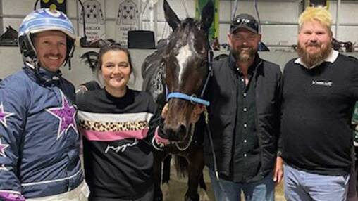 Blake and Ellen Jones alongside Hy Poactive and the connections of the horse at Riverina Paceway on Tuesday night. Picture by Riverina Paceway