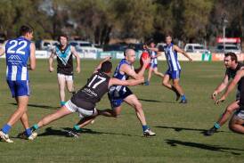 Temora's Jimmy Kennedy looks to burst through the tackle of Northern Jets' Nate Doyle in the Farrer League game at Nixon Park on Saturday. Picture by Tom Dennis