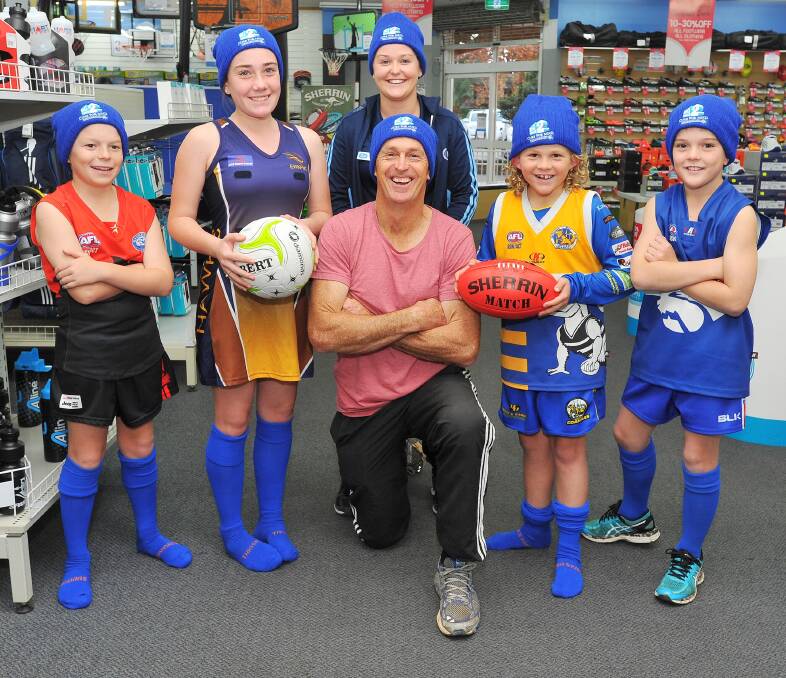 GOOD CAUSE: Wagga Swans' James Guthrie, East Wagga-Kooringal's Amy Leddin, Sportsmans Warehouse's Kelsey Leaver, Chris Daniher, Eastlakes-MCU's Logan Daniher and Turvey Park's Preston Schultz prepare for 'Sock it to MND' round on Sunday. Picture: Kieren L Tilly