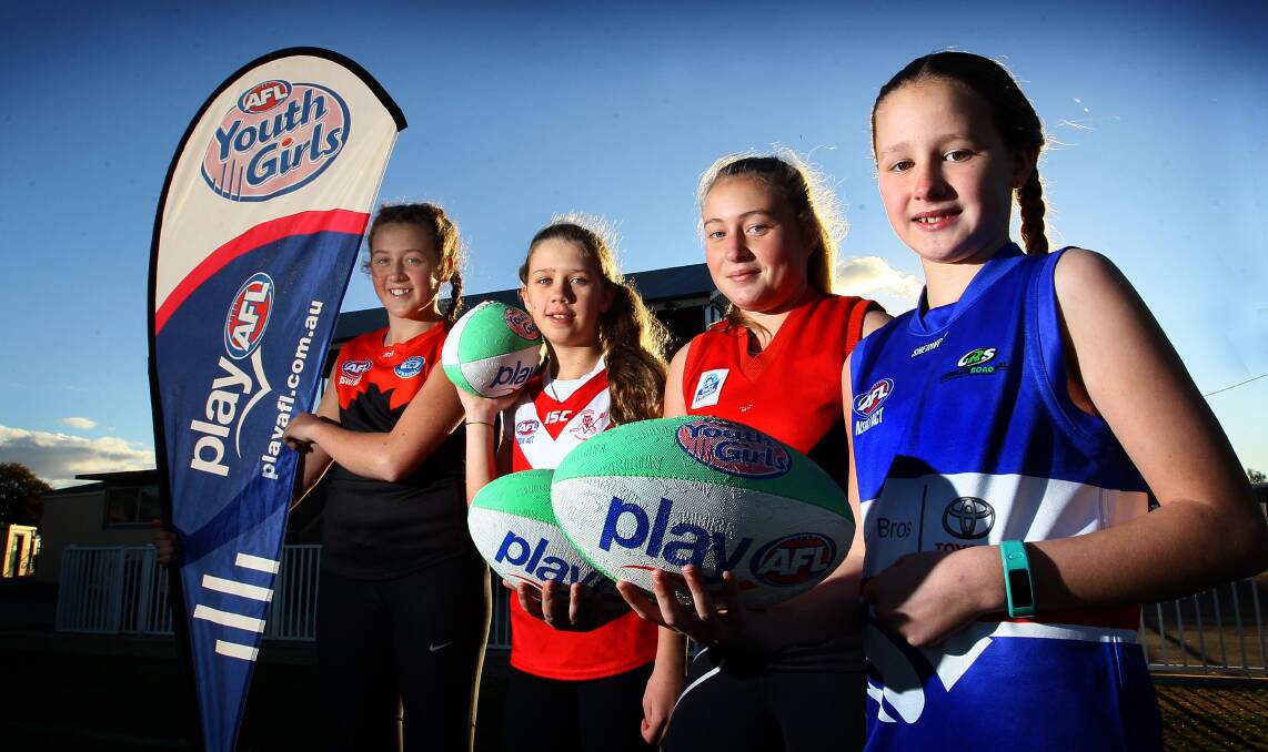 OUR TIME IS HERE: (from left) Lilly Buchanan, 14, Lilli Cool, 12, Abbey Bourke, 13, and Maggie Hallcroft, 11, gear up for the new girls AFL competition. Picture: Les Smith