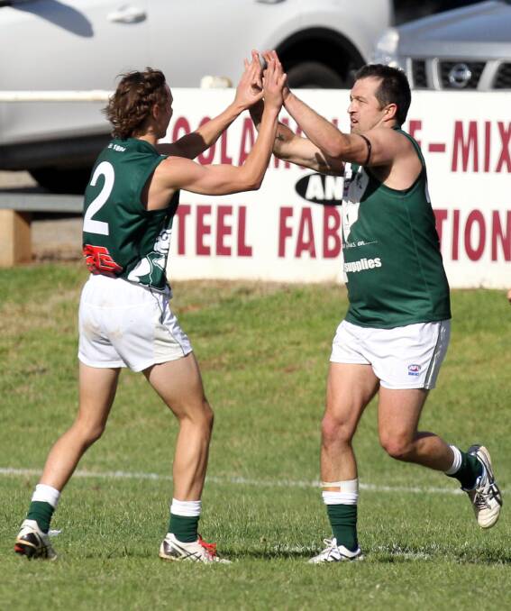 ON FIRE: New Coolamon forward Chris Ladhams (right) celebrates a goal with team mate Zac Stibbard at Kindra Park on Sunday. Picture: Les Smith