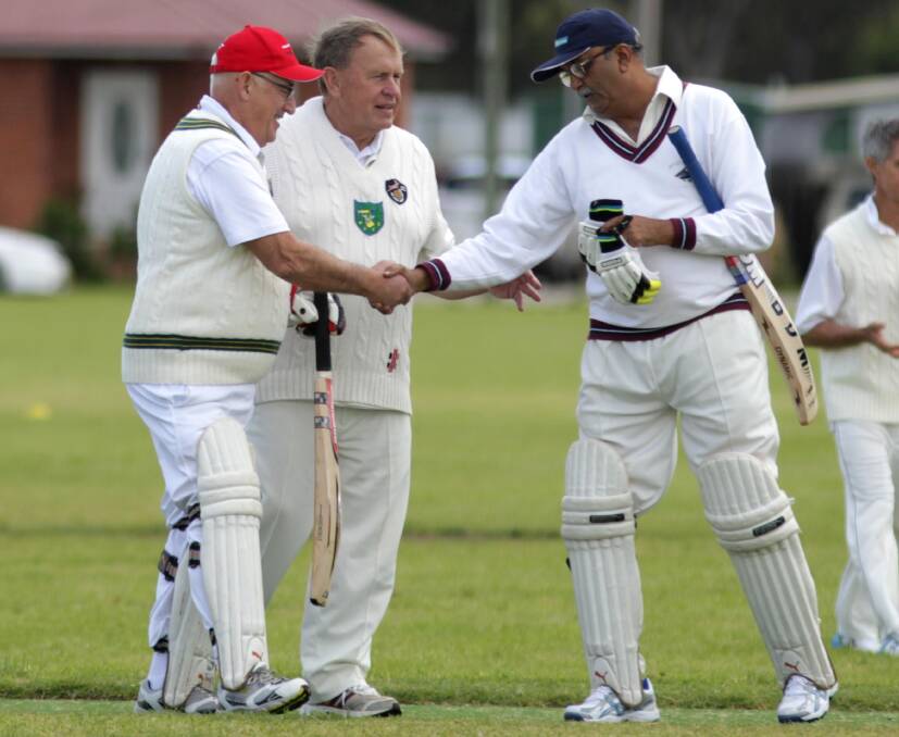 GOOD SPORTS: Arthur Manser (left) from Rotary Club of St Peters and Pradeep Godpole of Rotary Club Bombay shake hands as Norm Brown from Rotary Club of Bourne in Lincolnshire watches on. Picture: Les Smith