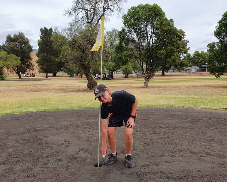 Rannock teenager Luke Dennis collects his ball out of the ninth hole at Coolamon Sport & Recreation Club last month. Picture supplied
